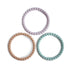 The mushie Pearl Teether Bracelet set features three silicone teethers in pastel lavender, tan, and light turquoise, arranged on a white background—combining style and soothing relief for babies.