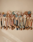 Lifestyle image of silicone pacifier clips