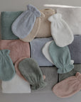 Lifestyle flatly of the Bath Mitt and Hooded Towel collection