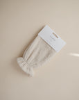 Mushie Fog Bath Mitt in packaging