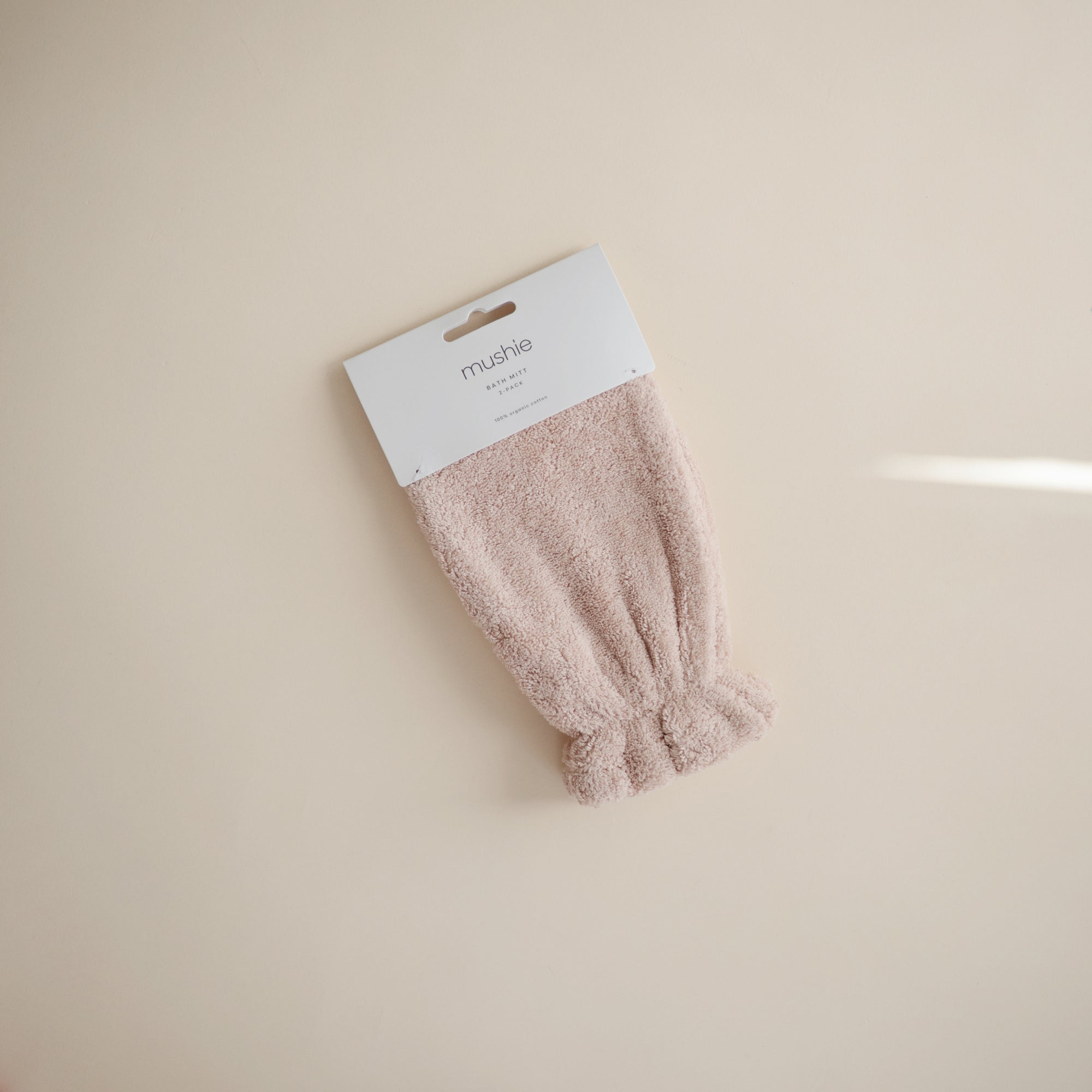 Mushie Blush Bath Mitt in packaging