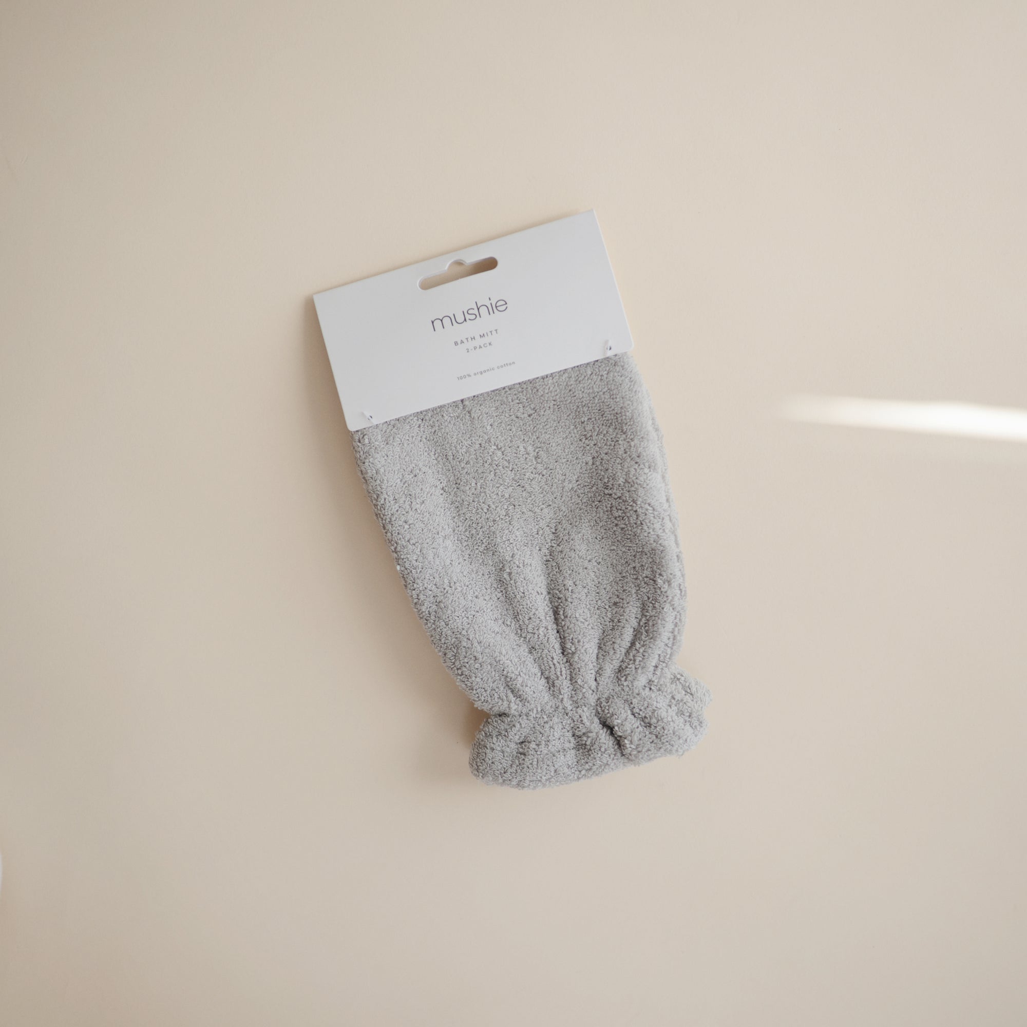 Mushie Gray Bath Mitt in packaging