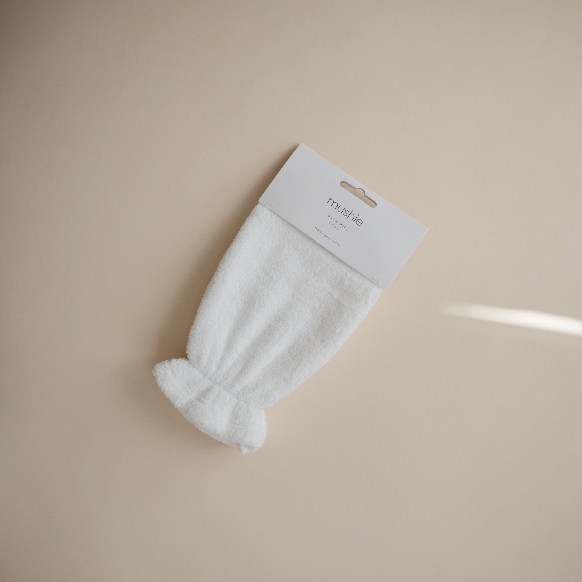 Mushie Pearl Bath Mitt in packaging