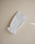 Mushie Pearl Bath Mitt in packaging