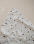 Lifestyle image of Organic Cotton Swaddle in Whales